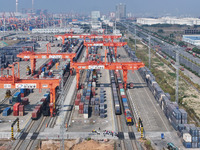 The X9578 Western Land-Sea New Channel rail and sea combined transport train departs from Qinzhou Railway Container Center station in Qinzho...