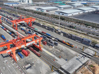 The X9578 Western Land-Sea New Channel rail and sea combined transport train departs from Qinzhou Railway Container Center station in Qinzho...