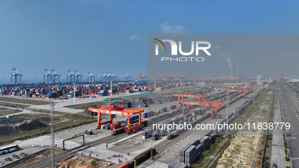 The X9578 Western Land-Sea New Channel rail and sea combined transport train departs from Qinzhou Railway Container Center station in Qinzho...