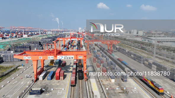 The X9578 Western Land-Sea New Channel rail and sea combined transport train departs from Qinzhou Railway Container Center station in Qinzho...