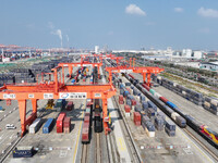 The X9578 Western Land-Sea New Channel rail and sea combined transport train departs from Qinzhou Railway Container Center station in Qinzho...