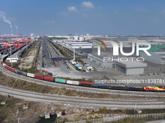 The X9578 Western Land-Sea New Channel rail and sea combined transport train departs from Qinzhou Railway Container Center station in Qinzho...