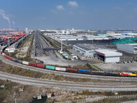 The X9578 Western Land-Sea New Channel rail and sea combined transport train departs from Qinzhou Railway Container Center station in Qinzho...