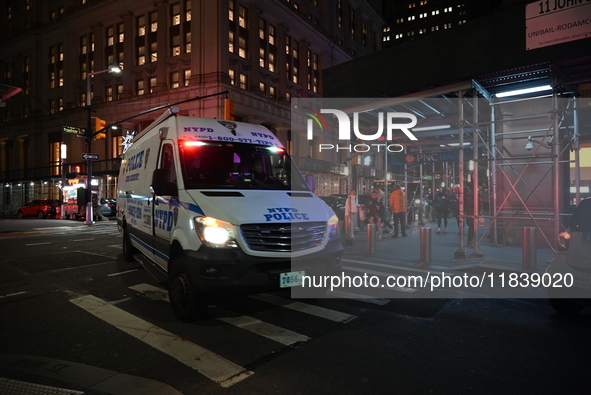 The NYPD Crime Scene Unit investigates the scene where one teenage boy is killed and one man is wounded in a stabbing in the Financial Distr...