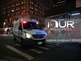 The NYPD Crime Scene Unit investigates the scene where one teenage boy is killed and one man is wounded in a stabbing in the Financial Distr...