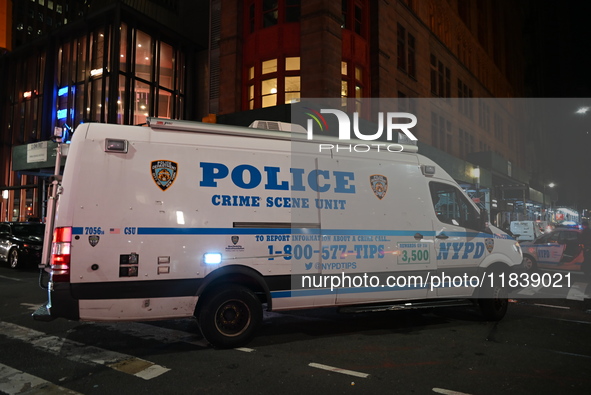 The NYPD Crime Scene Unit investigates the scene where one teenage boy is killed and one man is wounded in a stabbing in the Financial Distr...