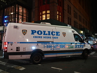 The NYPD Crime Scene Unit investigates the scene where one teenage boy is killed and one man is wounded in a stabbing in the Financial Distr...