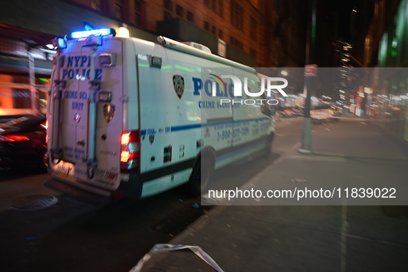 The NYPD Crime Scene Unit investigates the scene where one teenage boy is killed and one man is wounded in a stabbing in the Financial Distr...