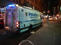 The NYPD Crime Scene Unit investigates the scene where one teenage boy is killed and one man is wounded in a stabbing in the Financial Distr...