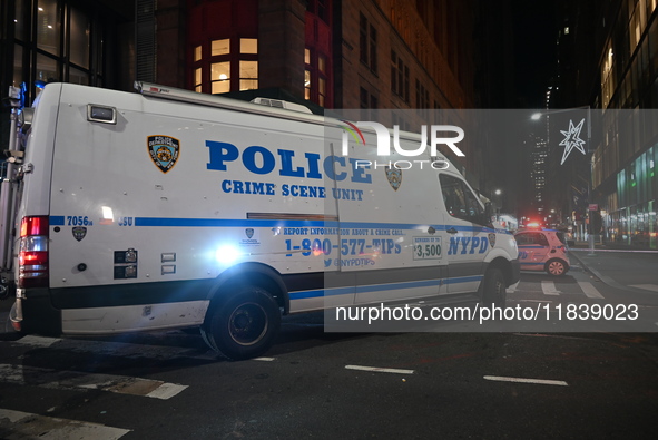 The NYPD Crime Scene Unit investigates the scene where one teenage boy is killed and one man is wounded in a stabbing in the Financial Distr...