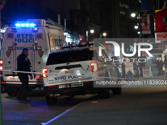 The NYPD Crime Scene Unit investigates the scene where one teenage boy is killed and one man is wounded in a stabbing in the Financial Distr...