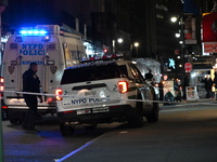 The NYPD Crime Scene Unit investigates the scene where one teenage boy is killed and one man is wounded in a stabbing in the Financial Distr...