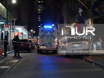 The NYPD Crime Scene Unit investigates the scene where one teenage boy is killed and one man is wounded in a stabbing in the Financial Distr...