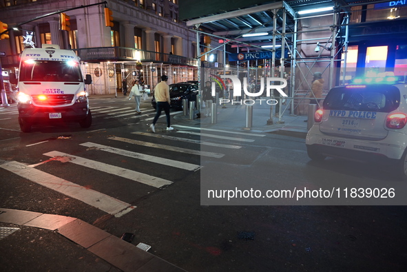 The NYPD Crime Scene Unit investigates the scene where one teenage boy is killed and one man is wounded in a stabbing in the Financial Distr...