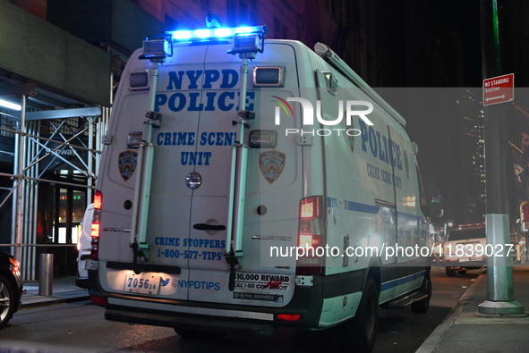 The NYPD Crime Scene Unit investigates the scene where one teenage boy is killed and one man is wounded in a stabbing in the Financial Distr...