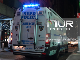 The NYPD Crime Scene Unit investigates the scene where one teenage boy is killed and one man is wounded in a stabbing in the Financial Distr...