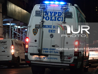 The NYPD Crime Scene Unit investigates the scene where one teenage boy is killed and one man is wounded in a stabbing in the Financial Distr...