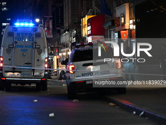 The NYPD Crime Scene Unit investigates the scene where one teenage boy is killed and one man is wounded in a stabbing in the Financial Distr...