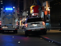 The NYPD Crime Scene Unit investigates the scene where one teenage boy is killed and one man is wounded in a stabbing in the Financial Distr...