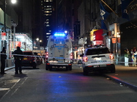 The NYPD Crime Scene Unit investigates the scene where one teenage boy is killed and one man is wounded in a stabbing in the Financial Distr...