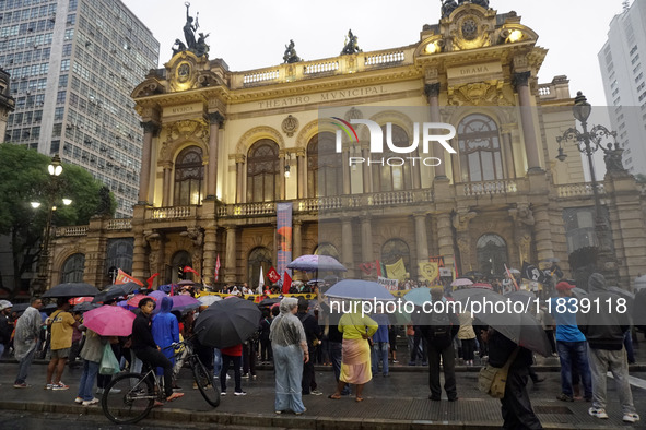 Demonstrators shout slogans as they participate in a protest against Sao Paulo's governor, Tarcisio de Freitas, and the violence of the poli...