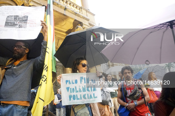 Demonstrators shout slogans as they participate in a protest against Sao Paulo's governor, Tarcisio de Freitas, and the violence of the poli...