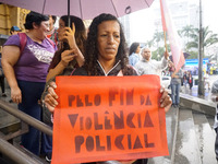 Demonstrators shout slogans as they participate in a protest against Sao Paulo's governor, Tarcisio de Freitas, and the violence of the poli...