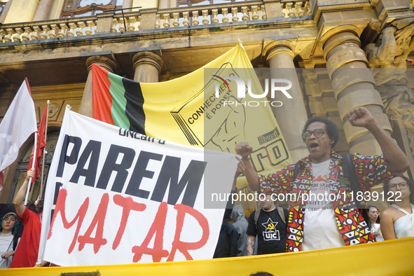 Demonstrators shout slogans as they participate in a protest against Sao Paulo's governor, Tarcisio de Freitas, and the violence of the poli...