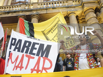 Demonstrators shout slogans as they participate in a protest against Sao Paulo's governor, Tarcisio de Freitas, and the violence of the poli...