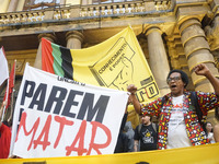 Demonstrators shout slogans as they participate in a protest against Sao Paulo's governor, Tarcisio de Freitas, and the violence of the poli...