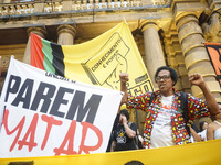 Demonstrators shout slogans as they participate in a protest against Sao Paulo's governor, Tarcisio de Freitas, and the violence of the poli...