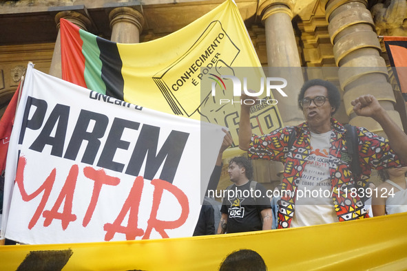 Demonstrators shout slogans as they participate in a protest against Sao Paulo's governor, Tarcisio de Freitas, and the violence of the poli...