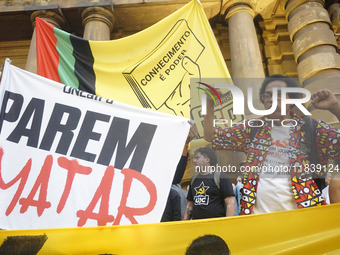 Demonstrators shout slogans as they participate in a protest against Sao Paulo's governor, Tarcisio de Freitas, and the violence of the poli...