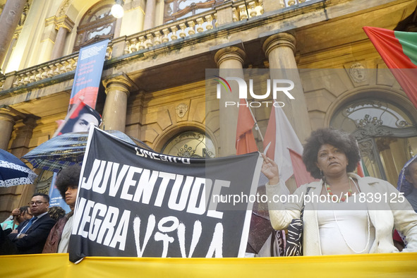 Demonstrators shout slogans as they participate in a protest against Sao Paulo's governor, Tarcisio de Freitas, and the violence of the poli...