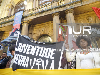 Demonstrators shout slogans as they participate in a protest against Sao Paulo's governor, Tarcisio de Freitas, and the violence of the poli...