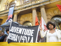 Demonstrators shout slogans as they participate in a protest against Sao Paulo's governor, Tarcisio de Freitas, and the violence of the poli...