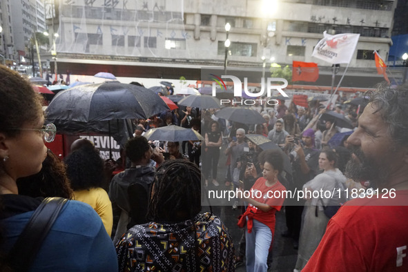 Demonstrators shout slogans as they participate in a protest against Sao Paulo's governor, Tarcisio de Freitas, and the violence of the poli...