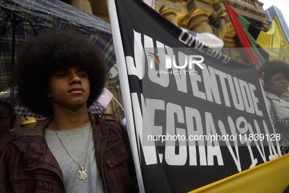 Demonstrators shout slogans as they participate in a protest against Sao Paulo's governor, Tarcisio de Freitas, and the violence of the poli...