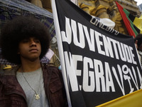 Demonstrators shout slogans as they participate in a protest against Sao Paulo's governor, Tarcisio de Freitas, and the violence of the poli...