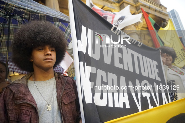 Demonstrators shout slogans as they participate in a protest against Sao Paulo's governor, Tarcisio de Freitas, and the violence of the poli...