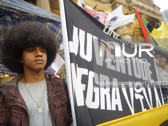 Demonstrators shout slogans as they participate in a protest against Sao Paulo's governor, Tarcisio de Freitas, and the violence of the poli...