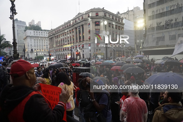 Demonstrators shout slogans as they participate in a protest against Sao Paulo's governor, Tarcisio de Freitas, and the violence of the poli...