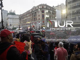 Demonstrators shout slogans as they participate in a protest against Sao Paulo's governor, Tarcisio de Freitas, and the violence of the poli...