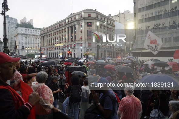 Demonstrators shout slogans as they participate in a protest against Sao Paulo's governor, Tarcisio de Freitas, and the violence of the poli...