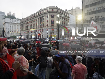 Demonstrators shout slogans as they participate in a protest against Sao Paulo's governor, Tarcisio de Freitas, and the violence of the poli...