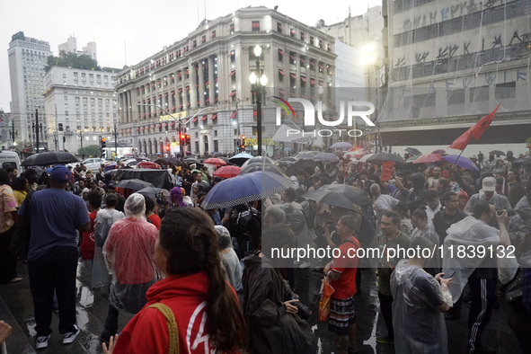 Demonstrators shout slogans as they participate in a protest against Sao Paulo's governor, Tarcisio de Freitas, and the violence of the poli...