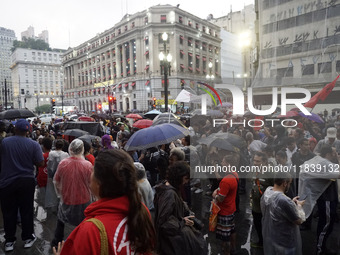 Demonstrators shout slogans as they participate in a protest against Sao Paulo's governor, Tarcisio de Freitas, and the violence of the poli...