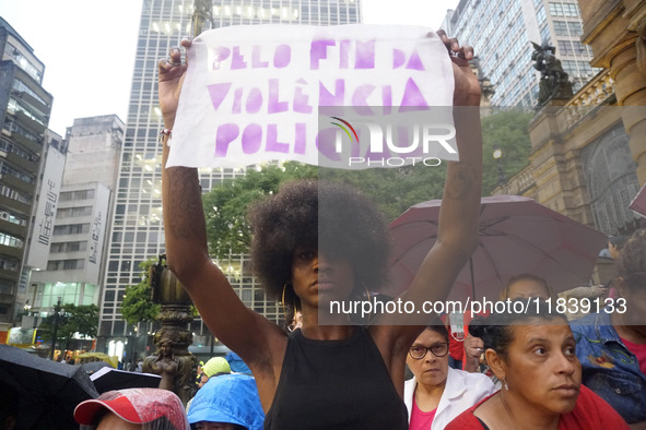 Demonstrators shout slogans as they participate in a protest against Sao Paulo's governor, Tarcisio de Freitas, and the violence of the poli...