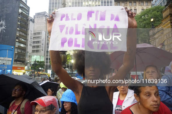 Demonstrators shout slogans as they participate in a protest against Sao Paulo's governor, Tarcisio de Freitas, and the violence of the poli...