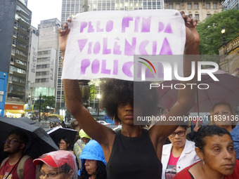 Demonstrators shout slogans as they participate in a protest against Sao Paulo's governor, Tarcisio de Freitas, and the violence of the poli...